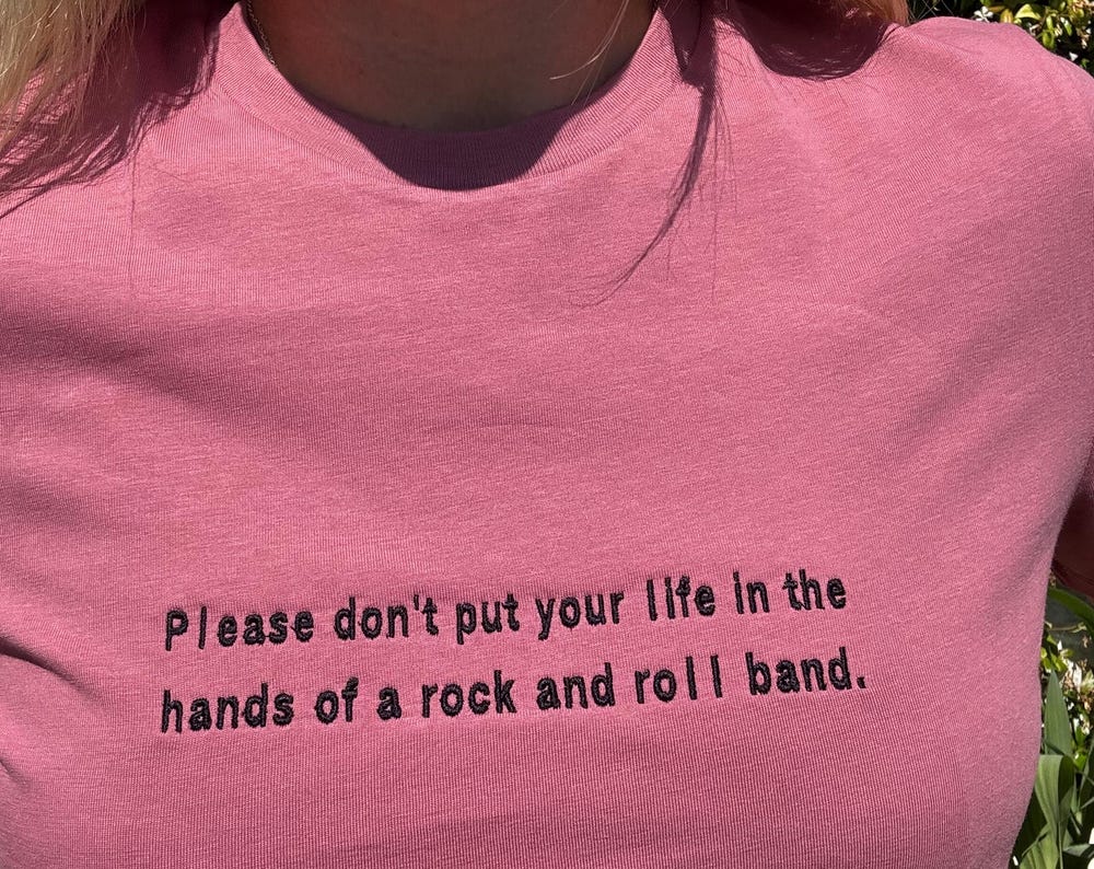 Oasis Lyric Embroidered T-Shirt – “Please don’t put your life…” | 100% Organic Cotton | Unisex | XS–5XL | Multiple Colors